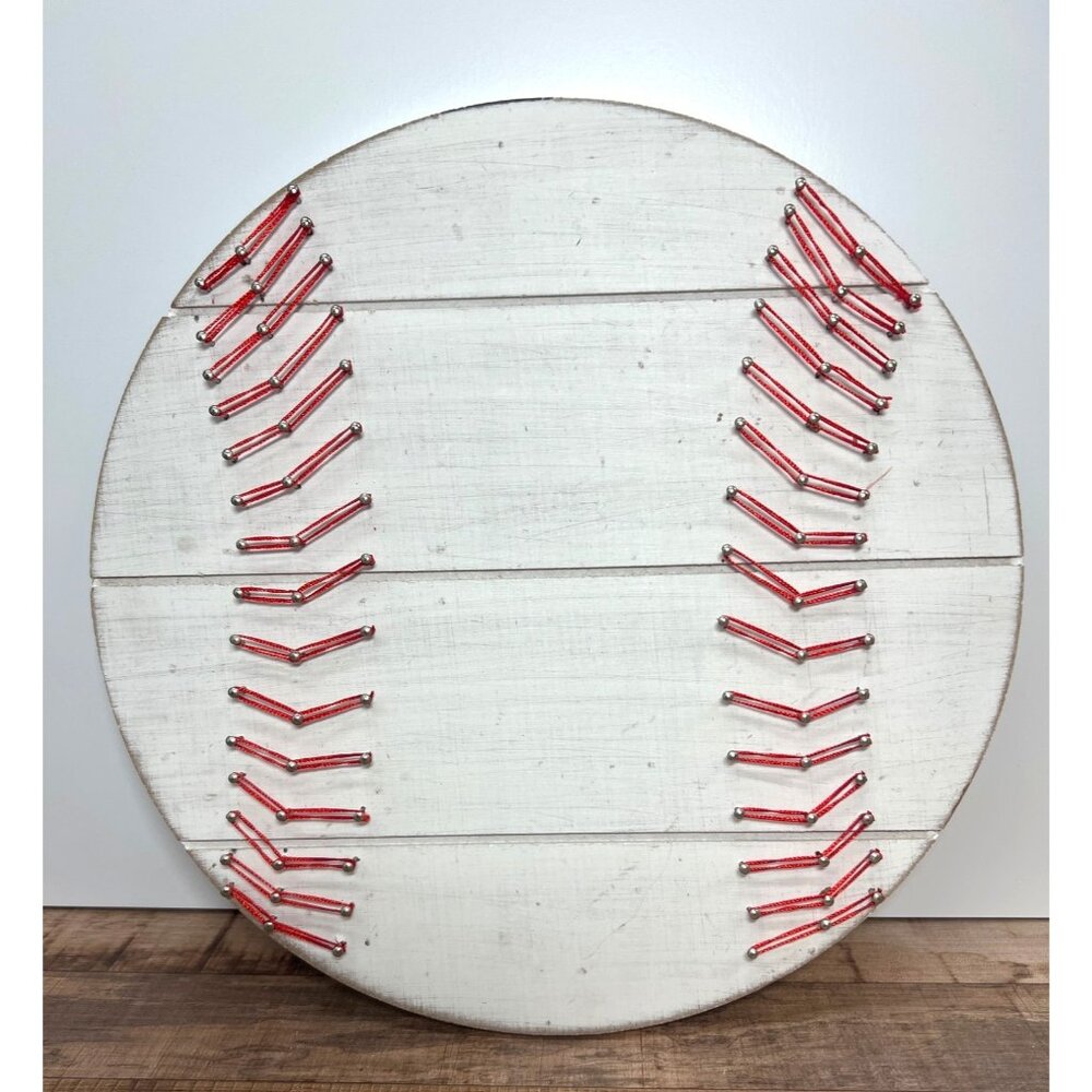 Baseball-Shaped Wooden Wall Decor With Red String Stitch Design